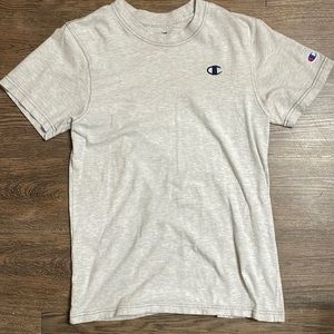 Light grey champion T-shirt with navy blue stitching